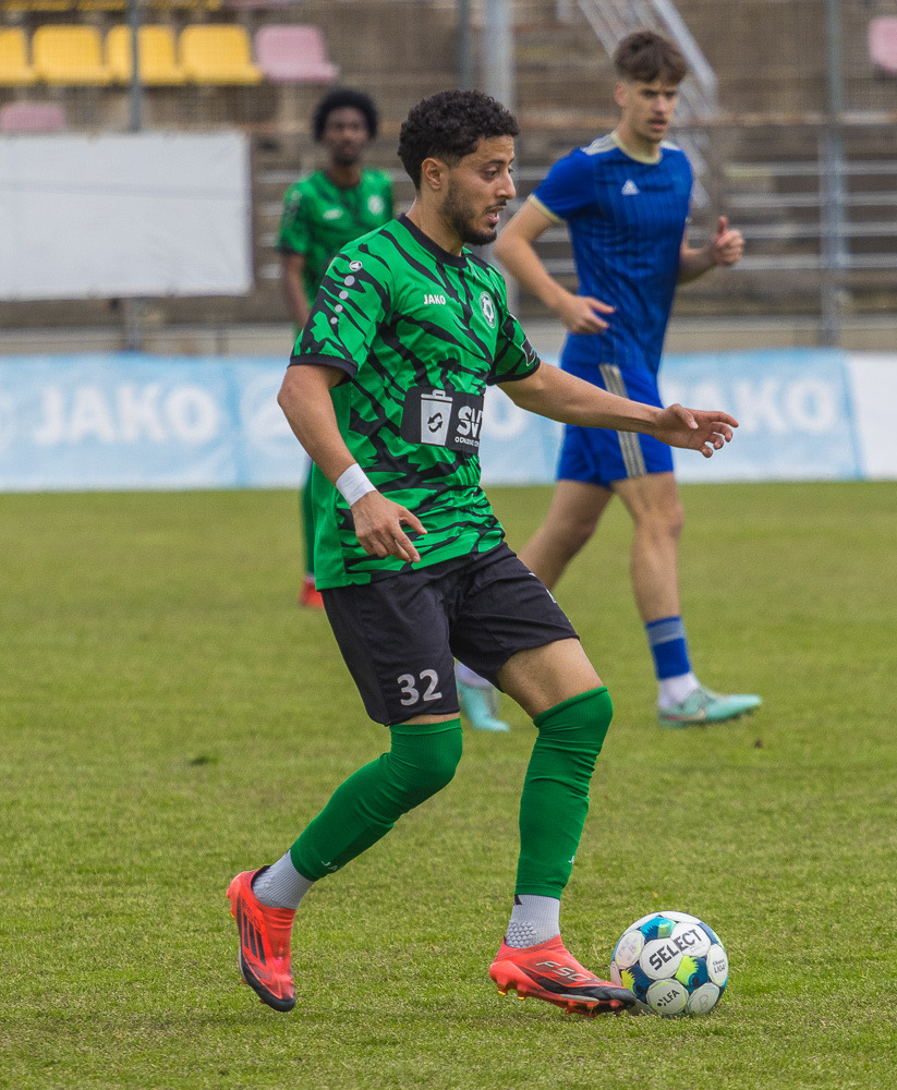 Adel Beggah driving forward with the ball